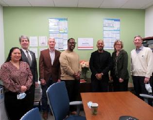 Board members and staff gathered in the Wellpoint Caregiver Resource Center.
