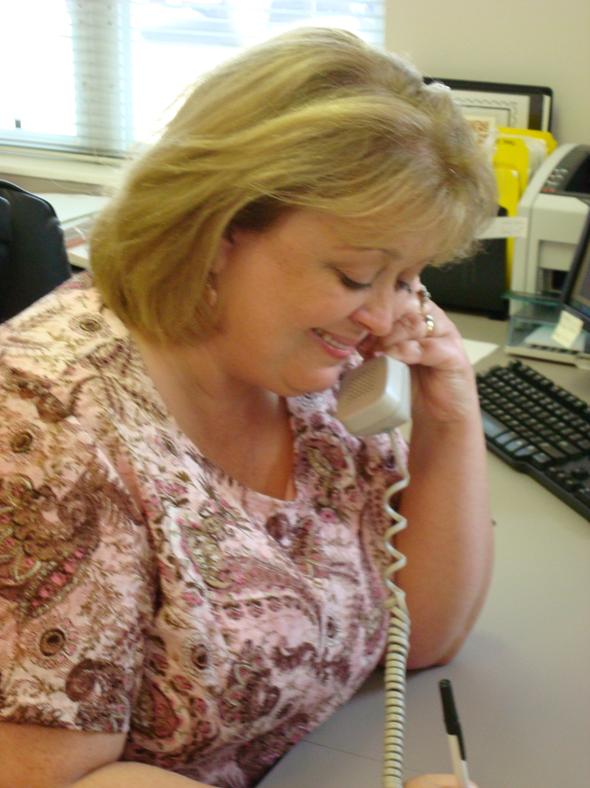 Lisa Stanton answering the phone