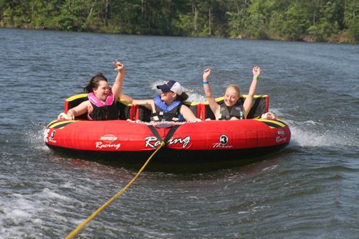 Campers riding inflatable