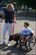 Frances and child with therapy dog