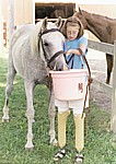 child feeding a horse