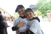 Two young participants wearing Walk With Me T-shirts