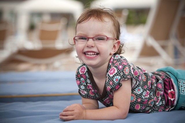 little girl in glasses